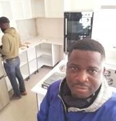 Man at work.kitchen cabinets