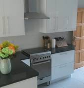 High gloss white Kitchen with Rustenberg Granite worktops