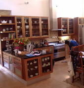 solid wood kitchen with glass inserts and Rustenberg granite