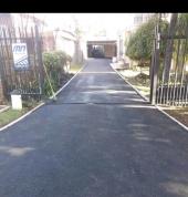 Tar surfacing for driveways, parking lot and cover potholes