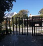 Palisade swing gates that can be automated as well. the client`s driveway was widened and the washed out parts repaired with concrete.