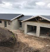 Arctix Architecture designs a main dwelling and a second dwelling for two families on one erf. The design develompent makes practical use of allotted space and boasts modern design features.  The leveling is done so that both dwellings overlook the ocean