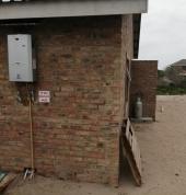 Gas geyser installation with buried pipe lay.