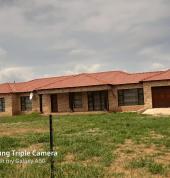 A 12 roomed home build up including roofing. With a feel at home touch. Aluminized windows.