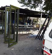 Folding doors charcoal in colour at work shop