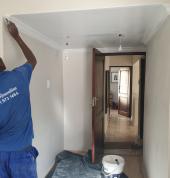 2. Painting the repaired ceiling.