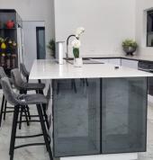 We used iceberg white and a mixture of kalapan gloss because it is easy to clean and maintain. Its non-porous surface repels stains and allows for effortless removal of dirt, making it a breeze to keep your surfaces looking immaculate with just a simple w