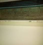 Dirty blocked Aircon with growing mildew.