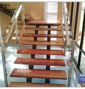Steel and wood staircase with glass balustrades