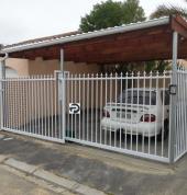 Double sliding gates for carport opening
