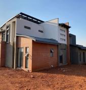 New building, plastering, boundary walls and paving.