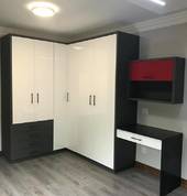 Bedroom cupboards in mealmine and high gloss white combination