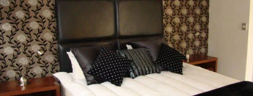 Flock wallpaper to add warmth to a spare room