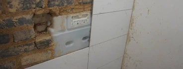 Gebrik toilet flushes installation and tiling at a Hospital