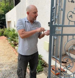 Rosebank Locksmiths - Parkwood - Locksmith Gregory Working on Security Gate Lock 1