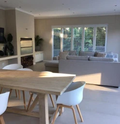 A new braai and entertainment area opening up onto a new hardwood timber pool deck, in the southern suburbs of Cape Town..