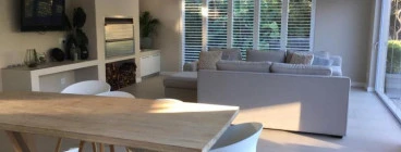 A new braai and entertainment area opening up onto a new hardwood timber pool deck, in the southern suburbs of Cape Town..