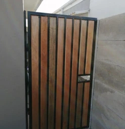 Steel gate with meranti and steel tube inserts. This door offers both privacy and security and can be used in conjunction with a privacy screen made in a similar fashion