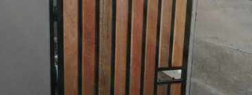 Steel gate with meranti and steel tube inserts. This door offers both privacy and security and can be used in conjunction with a privacy screen made in a similar fashion