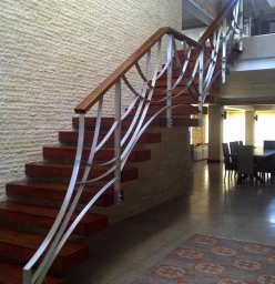 Cantilevered staircase with designer Stainless steel balustrade