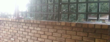 Wall plus steel fence
