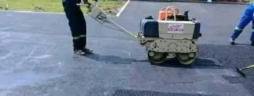 Indlu Yegagu Iyanetha laying tar driveway and road