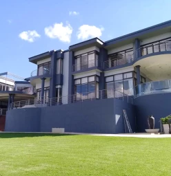 Exterior Painting. The company took 23 days to finish this project. It was an exhaustive project which included damp proofing, re plastering worn old plaster, and some big cracks that needed attention.  There was the use of scaffolding to access high area