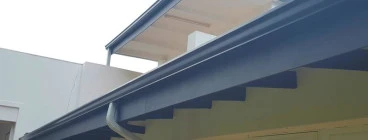 Black Industrial gutters with White pipes in Pretoria